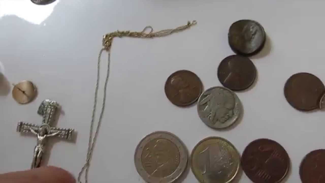 Coins and jewelry spread across a table